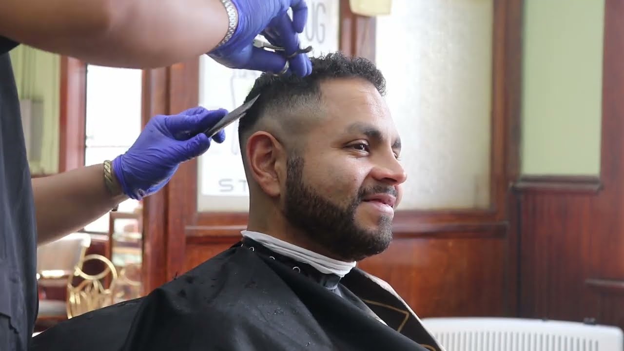Medium high fade/skin and trim on the top with shears HAIRCUT #31