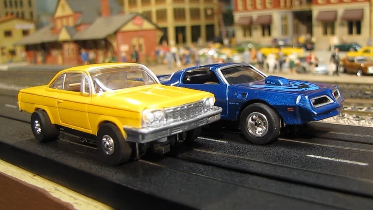 Slot Cars Firebird vs Bel Air on Model Train Layout Soo Line