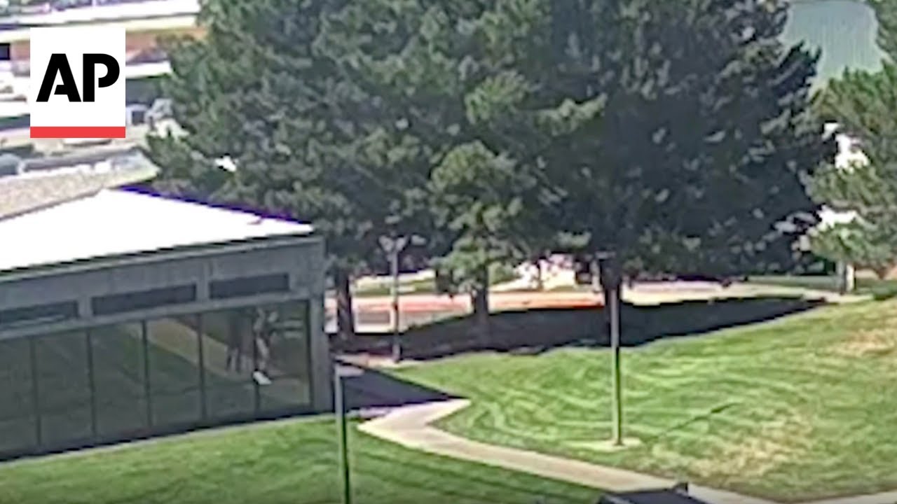 CCTV video shows suspect climbing down off roof after Charlie Kirk shooting