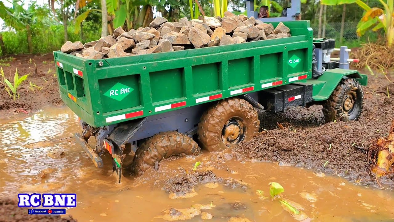 RC BNE _ Trucks carrying stones to remote areas