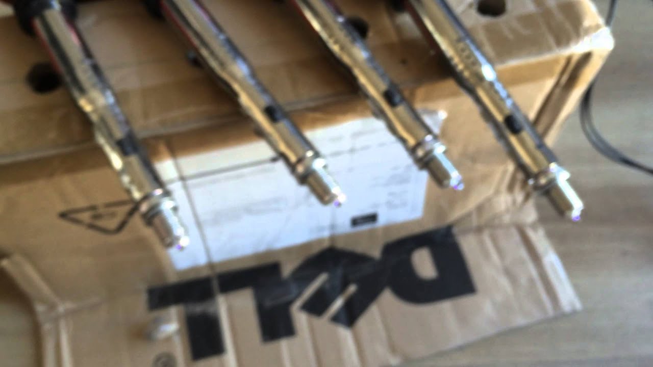 Arduino controlled 4cyl ignition system running VAG R8 COP's with NGK iridium spark plugs!