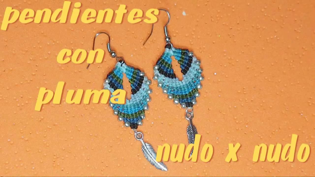 PENDIENTE CON PLUMA