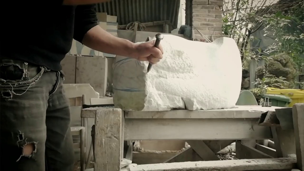 Hand carving marble in Tuscany