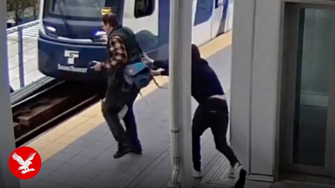 Every commuter's worst nightmare as video shows stranger creep up and shove man in front of train
