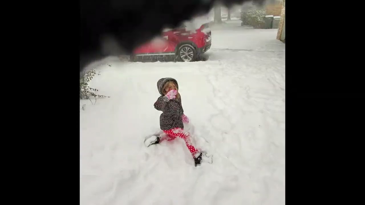 Playing in the snow again…and my hood is in the way  Oops!
