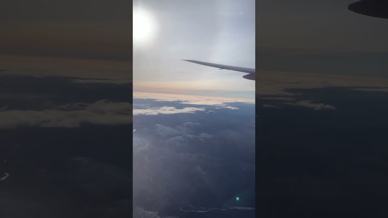 Flight over the taiga view through the clouds 