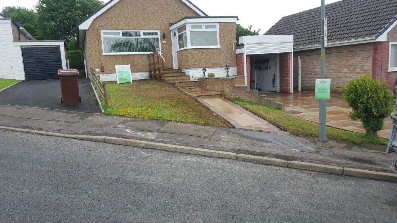 A Jones & Sons Driveway & Landscape Design.. Indian stone Driveway with Tegla block borders