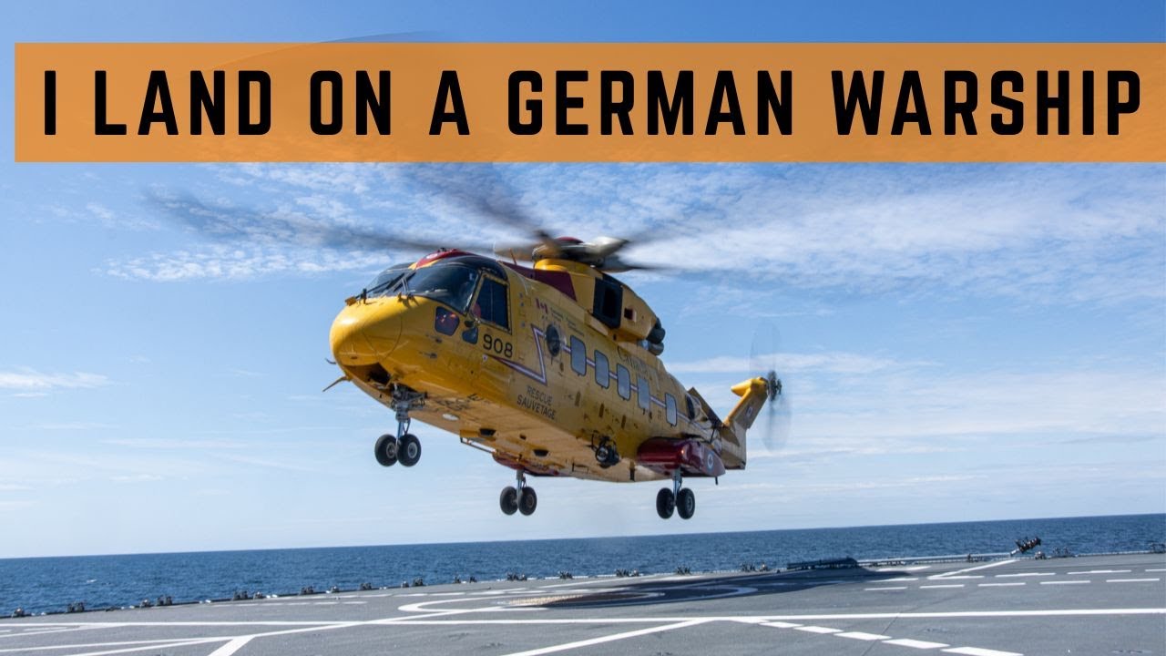 Cormorant helicopter joins a Navy exercise and practices hoisting and ship landing.