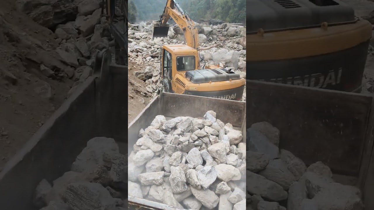 JCB Hyundai 140 truck loading in rock