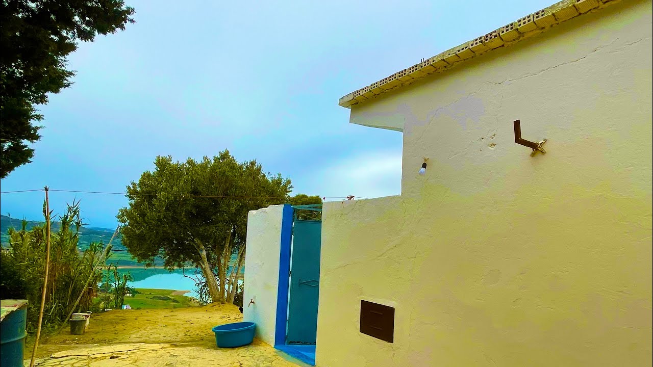 دار وغرسة راءعة مطلة على الطبيعة والسد واصل الماء والكهرباء 0703640826 نواحي الخميس انجرة طنجة