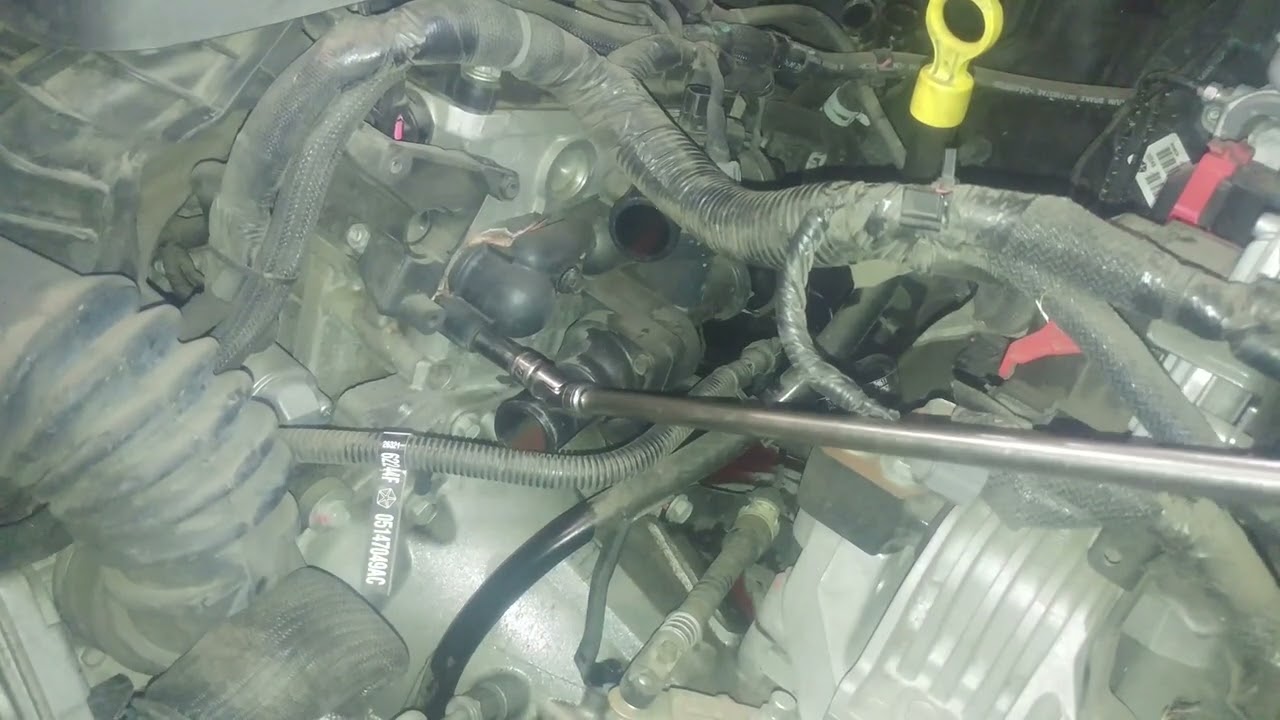 Thermostat housing assembly replacement 2013 Dodge Journey 2.4L.  Two thermostats in housing.