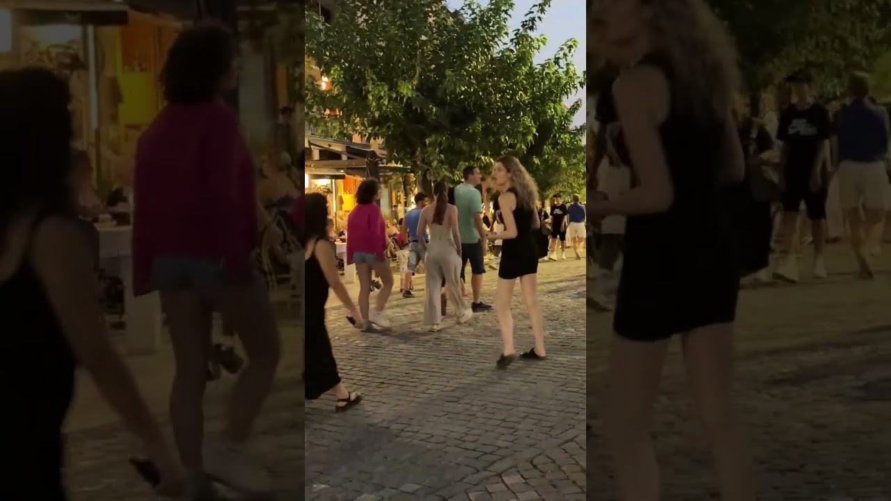 People Taking a Walk under Acropolis