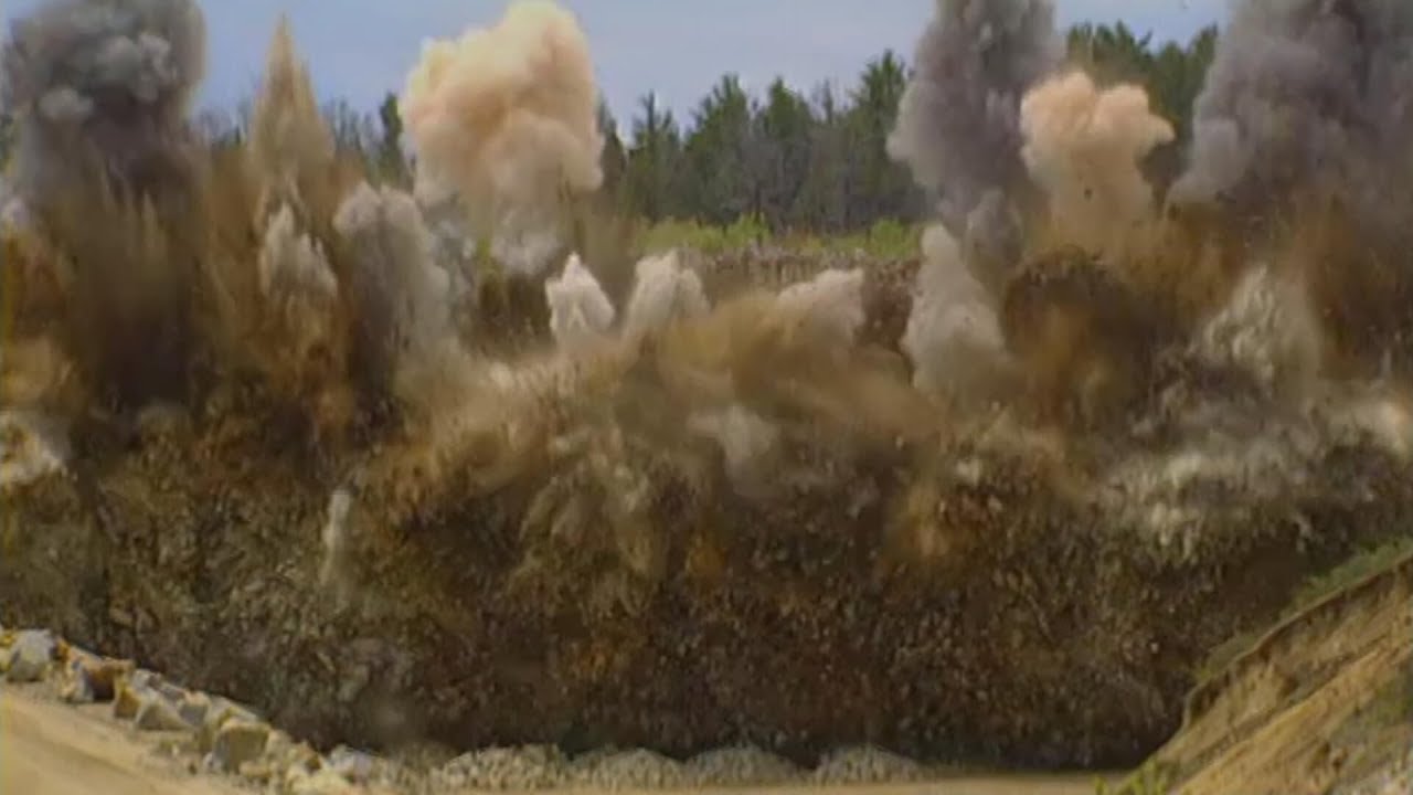 Blasting Crew Loading Explosives And Blowing Up Solid Rock At A Quarry from House Construction Ahead