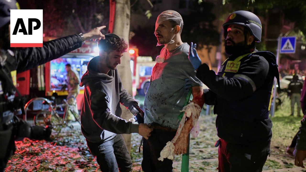 Cars on fire in Tel Aviv as Iran retaliates after US and Israel strikes