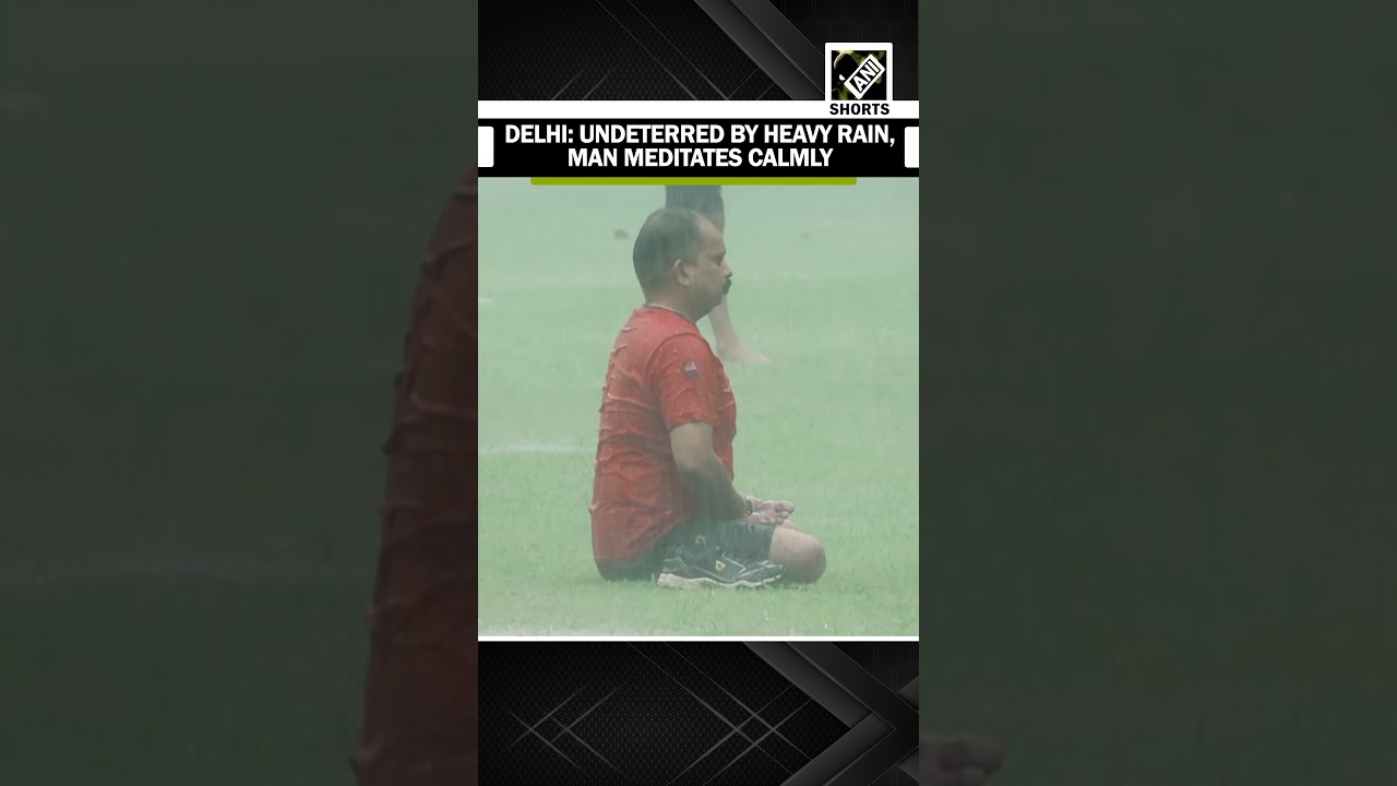 Undeterred by Heavy Rain, Man Meditates Calmly; visuals from Delhi&rsquo;s Shanti Path