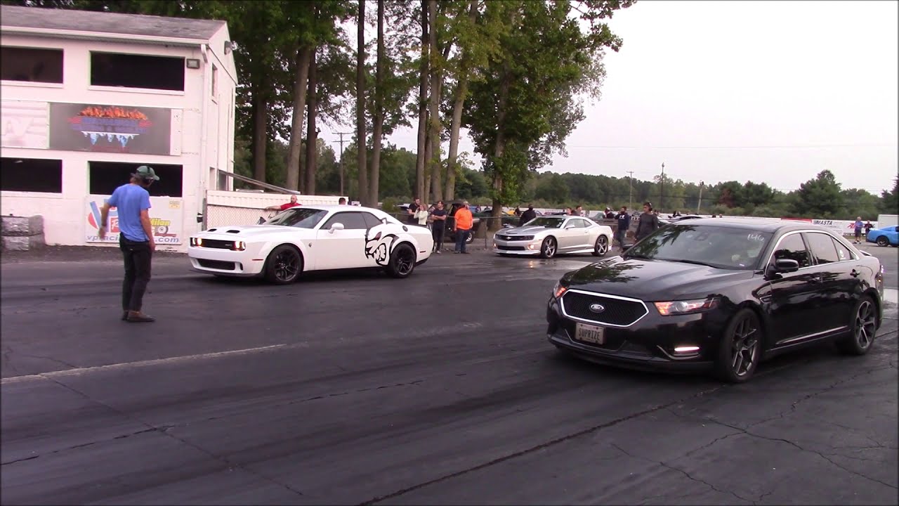 2015 Ford Taurus SHO vs Dodge Challenger Hellcat Redeye at Milan Dragway in Michigan