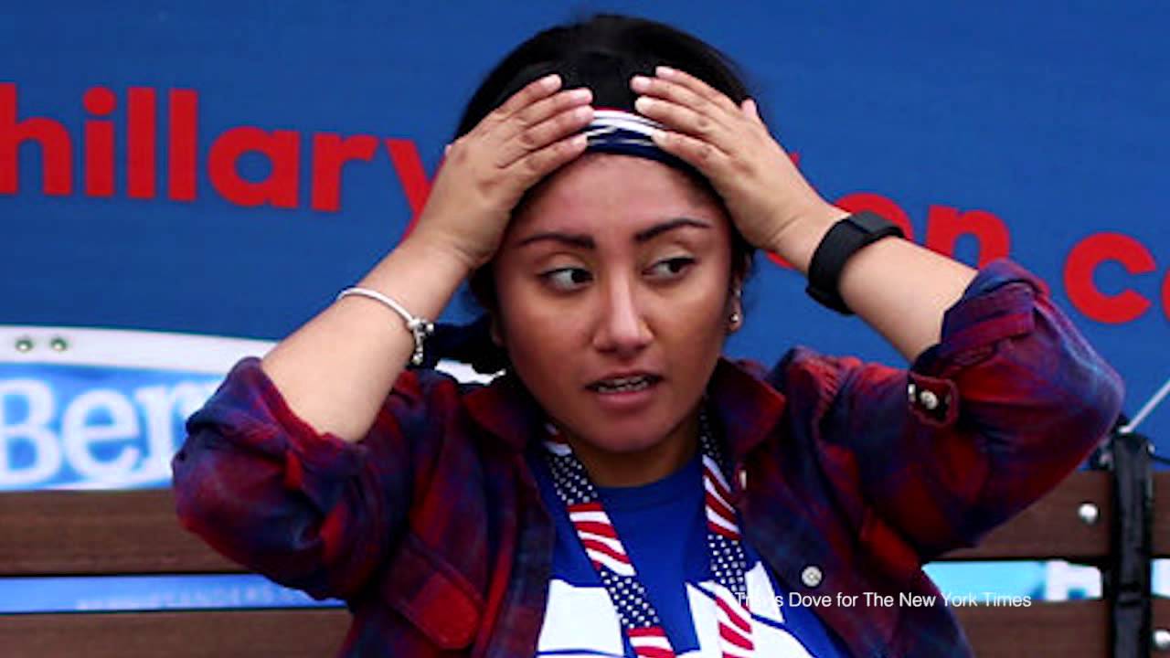 Young Campaign Worker, Dueling Hillary and Bernie Signs
