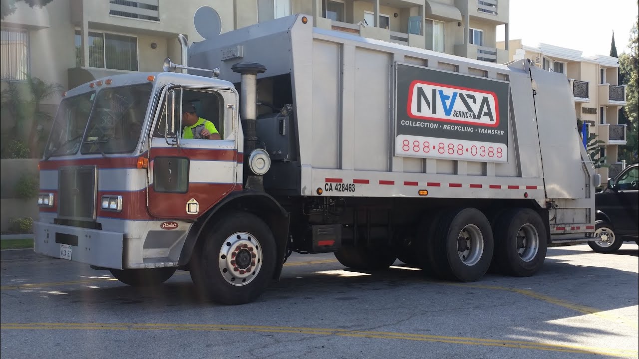 Peterbilt 310 Heil Formula 5000 Rear Load Garbage Truck (NASA Services R7)