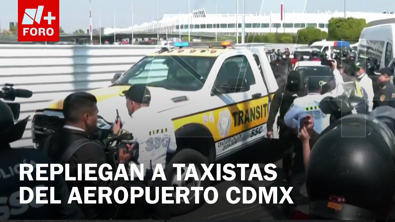 Policías retiran con grúas a taxistas que bloqueaban la T2 del AICM