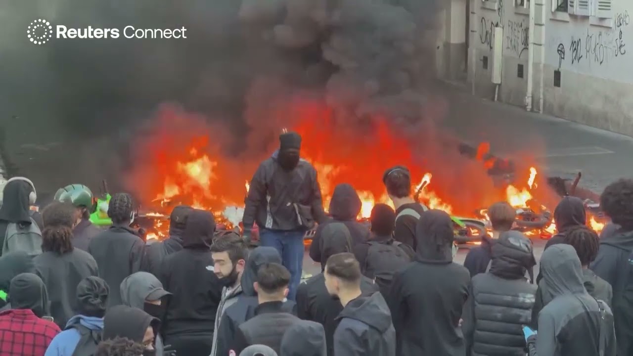 Fires burn in Paris streets as chaotic protests continue for second consecutive night