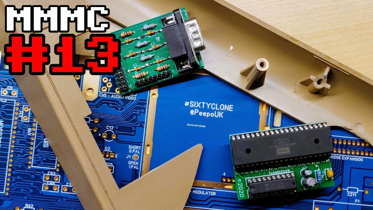 A smashed C64, a C128 to SCART adapter, a W65C02S to 6502 adapter and a replica C64