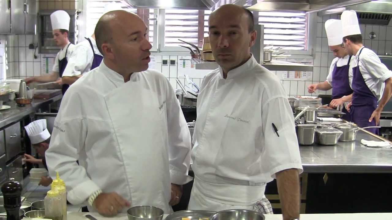 The twins Jacques & Laurent Pourcel prepare a dish at Le Jardin des Sens