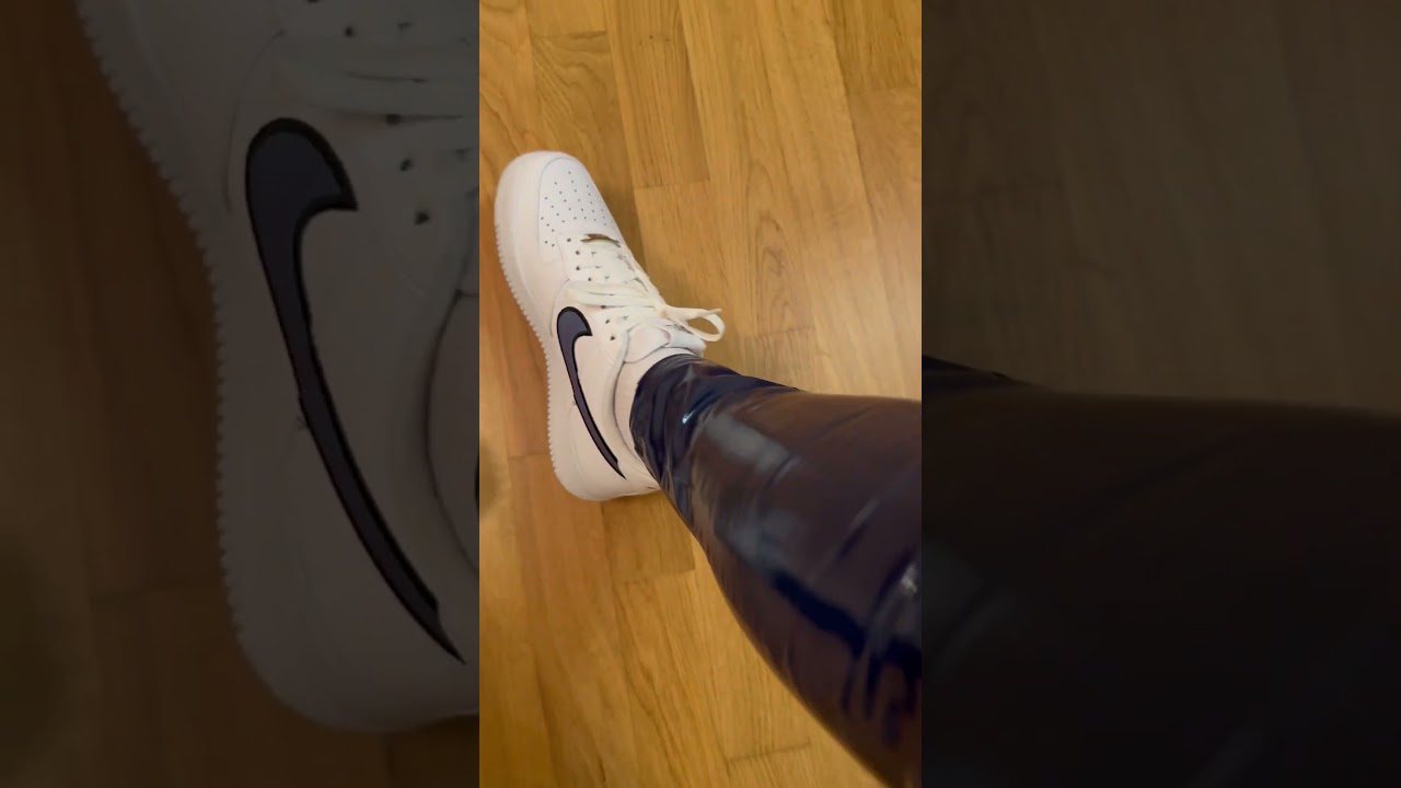 Detail look on blue Adidas Latex Leggings with white Nike Air Force 1