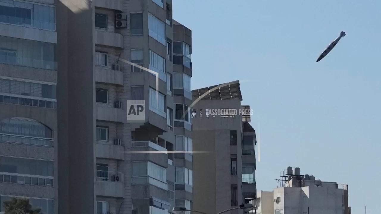 A bomb dropped from an Israeli jet hits a building in Beirut