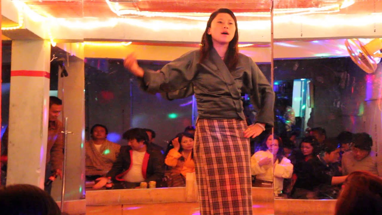 Bhutanese girls dancing to Bhtanese songs in a drayang (Bhutan's version of Dance bar) in Thimphu