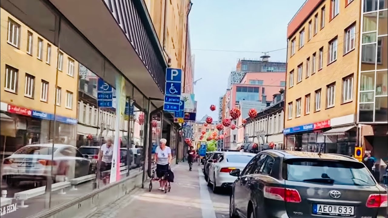Swedish city walk: Norrköping. City streets to central station. Everyday life with street sound
