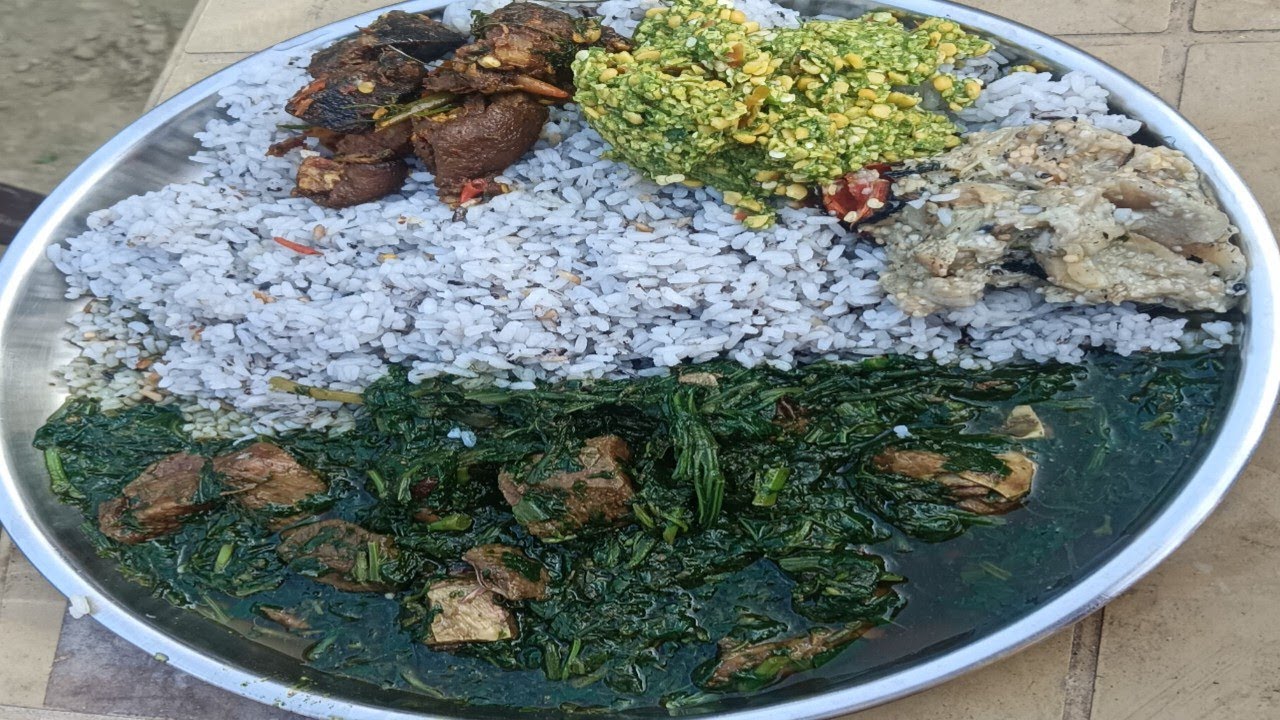 Green saag with smoked pork // pork dry fry // bengan bharta // chatni and one muli
