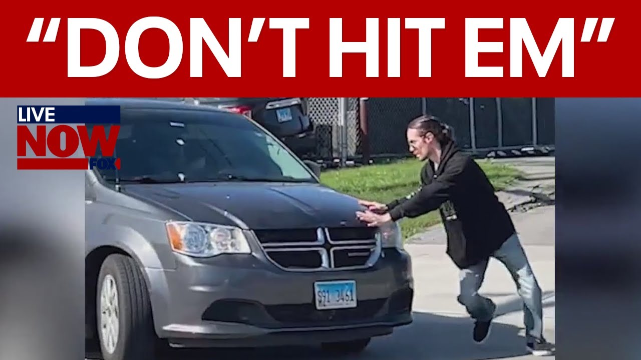 VIDEO: Protestor blocks ICE van in Chicago