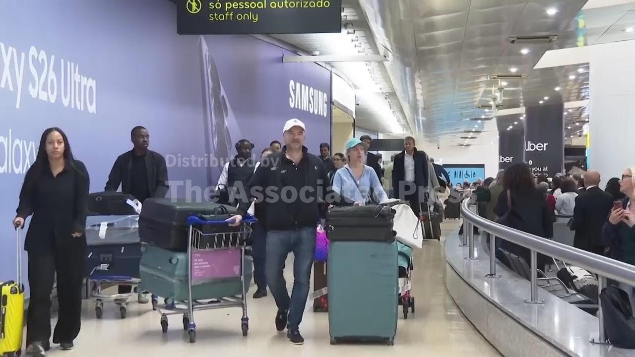 Travellers from Dubai reunite with family and friends as they arrive in Lisbon on commerical flight