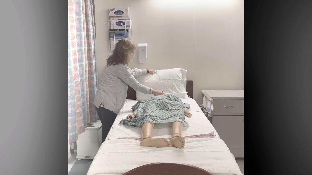 Moving a Resident to the Side of the Bed