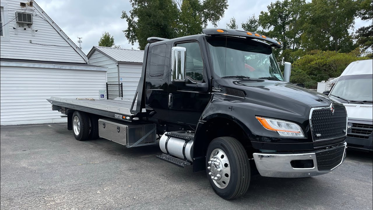 Tow trucks rollback for sale how to buy how we equip them with safety and towing equipment ￼gear