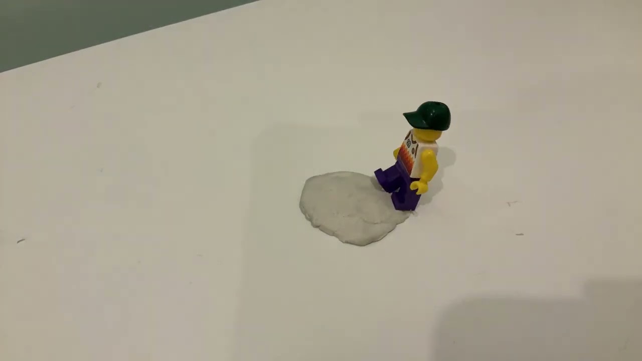 Stop motion man sinking into clay