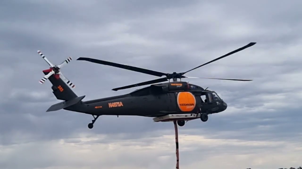 CFA ST0251/AIRCRAFT: HT345 landing and departing Bendigo airbase while CFA assembled at Huntly FS