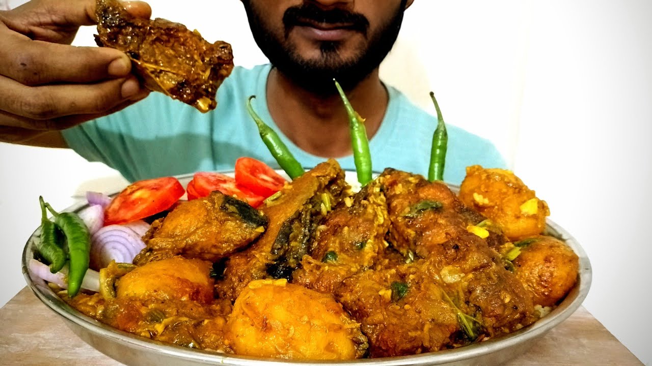 Eating Fish Curry With Aalu White Rice Salad and Extra Gravy