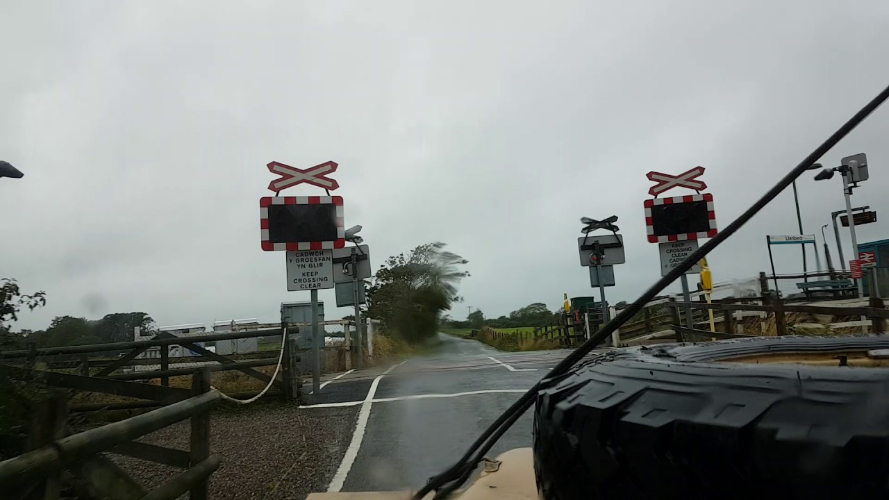 Land Rover 110 driving across Shell Island causeway