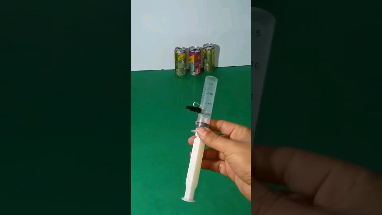 Make a small gun from a syringe using perfume