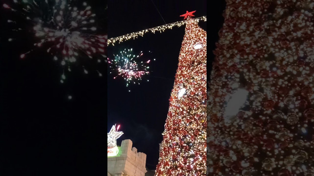 Christmas tree and fireworks in the city Nazareth in December 2020 Салют и новогодняя елка Назарет