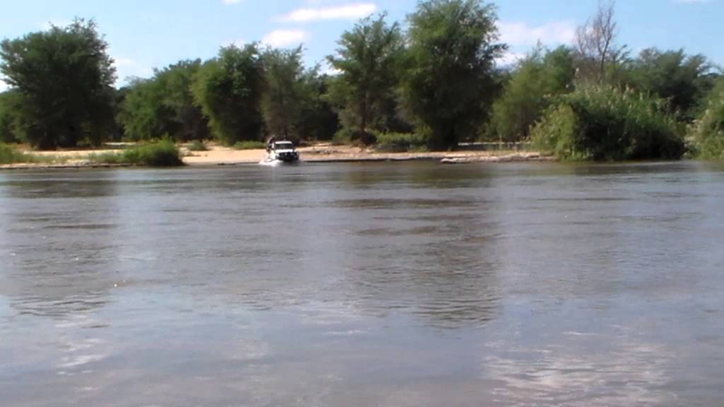 Toyota Land Cruiser crossing a river in Mozambique