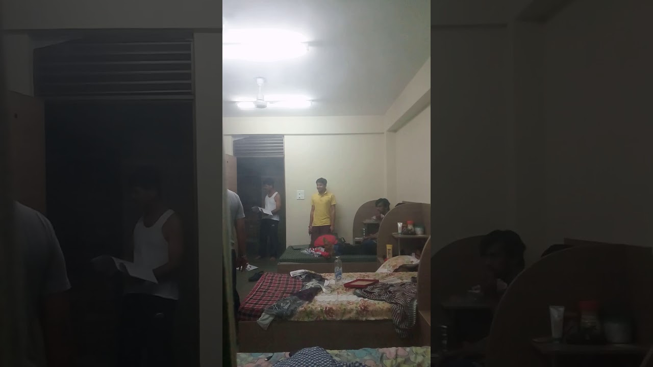 College hostel warden barges in room finding students making ruckus.