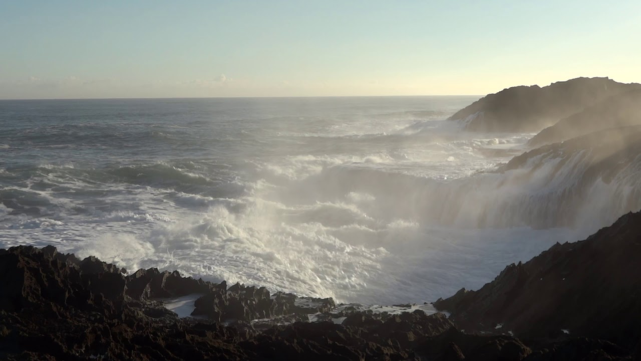 Waves crashing on shore stock video