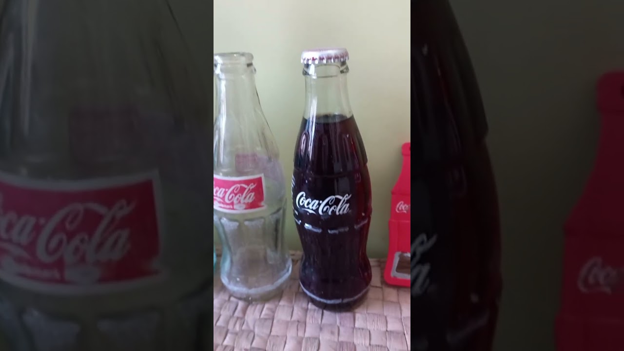 My Coca-Cola Collection of glass bottles,  cans, and cool merchandise