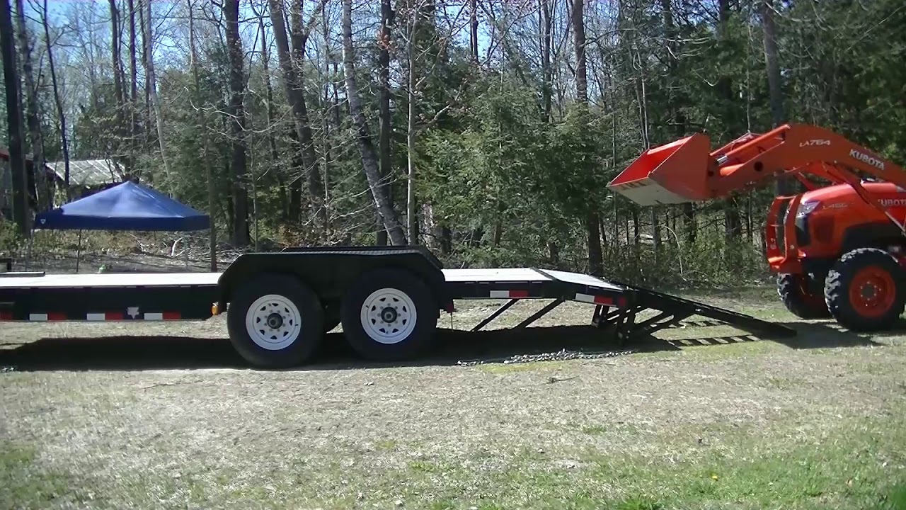 #83 Loading Kubota L4600 on the flatbed trailer in Maine