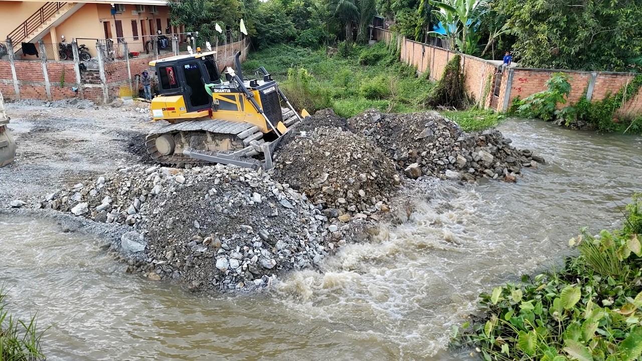 Nicely Process Land Transforming​ Operation Dozer Shantui Pushes Soil Mixed Stone, Dump Truck Unload