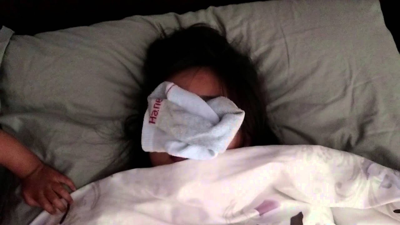 Emma puts dirty socks on mom's face and high 5 me.