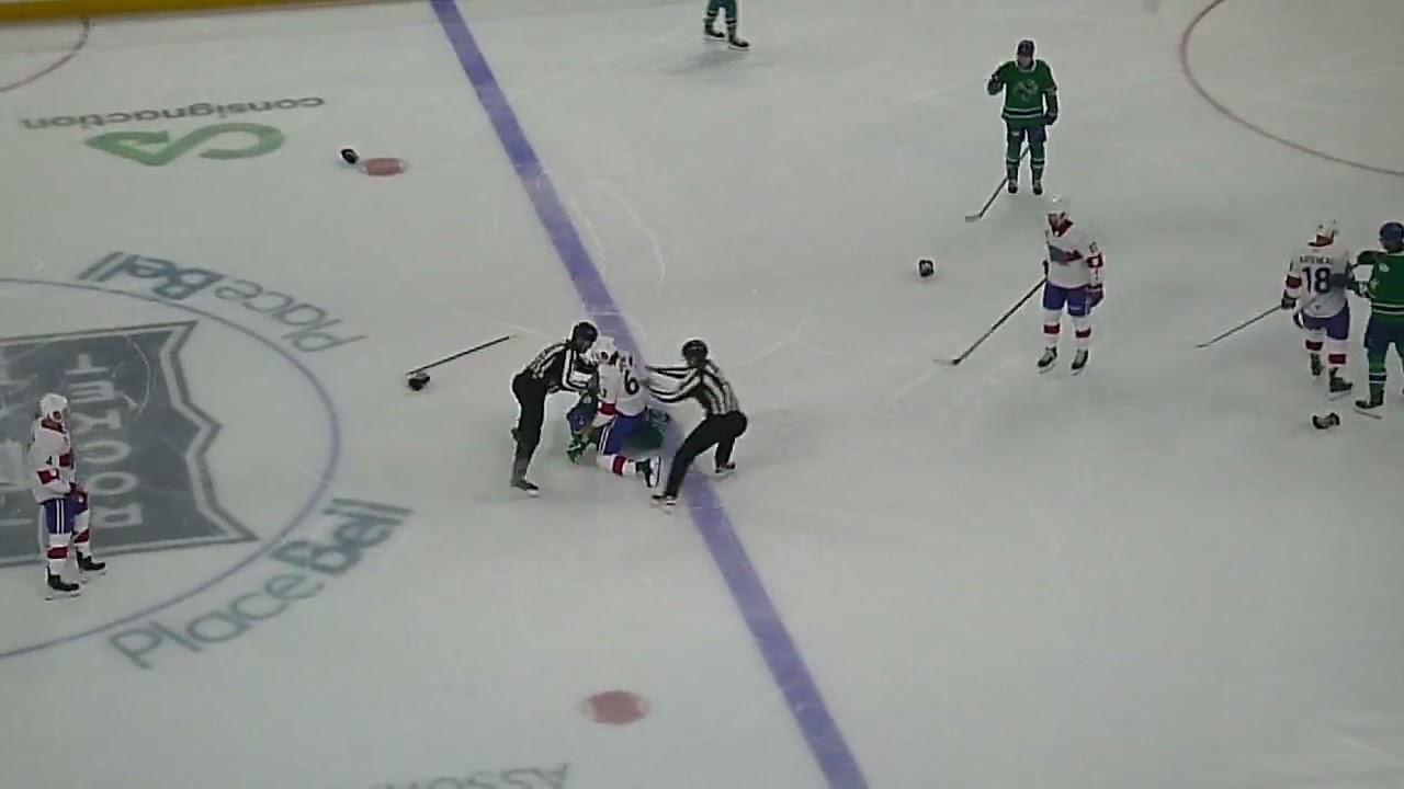 Laval Rocket's Florian Xhekaj and Abbotsford Canucks' Chase Stillman get into a fight 10/18/25