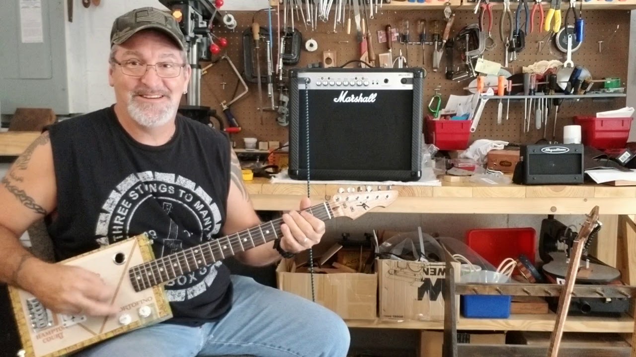 6 string Cigar Box Guitar - Large Vintage Macanudo Box - Sounds and Plays great.